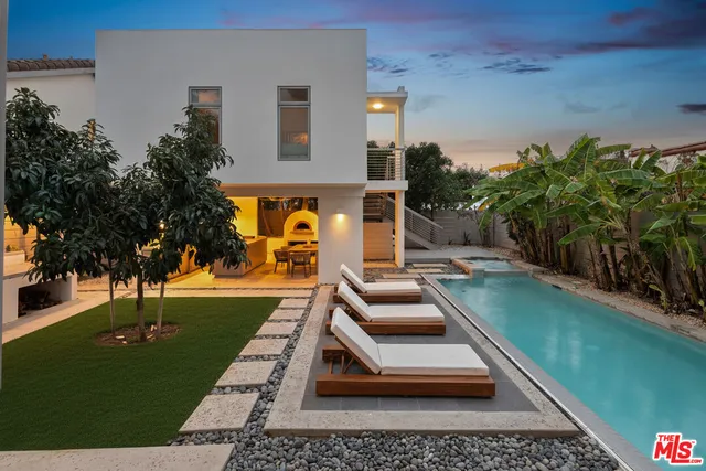 swimming pool view with a garden space