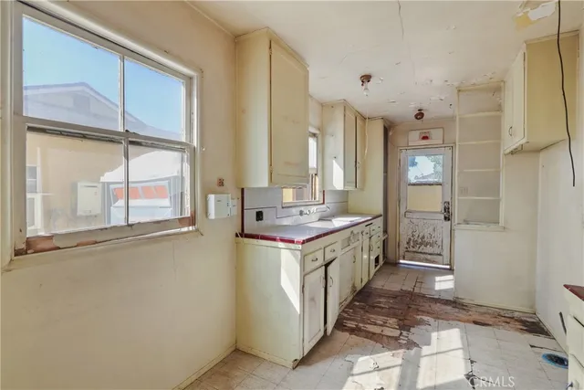 a kitchen with stainless steel appliances granite countertop a stove and a refrigerator