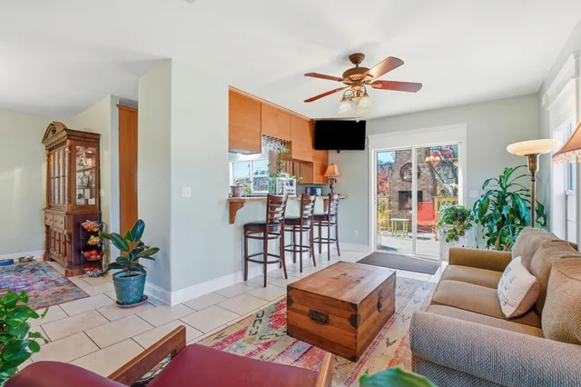 a kitchen with stainless steel appliances granite countertop a stove a sink dishwasher and a microwave