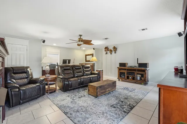 a bedroom with a bed and a lamp