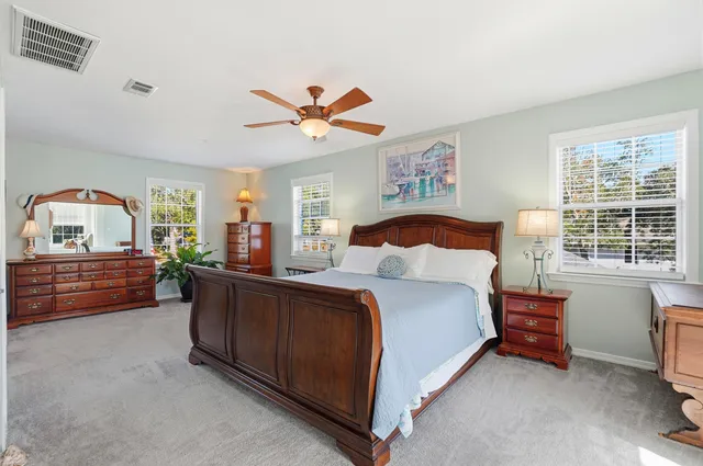 a spacious bathroom with a sink a mirror and a shower