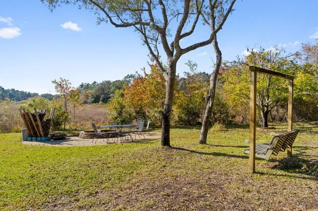 a view of a backyard with sitting area