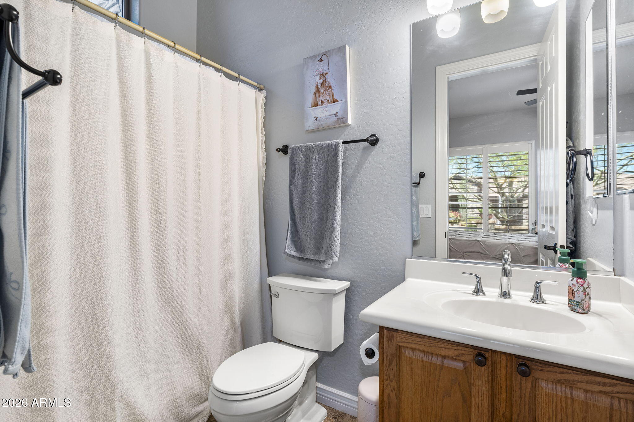 41619 North River Bend Road Anthem, AZ 85086 - Photo 21 of 84 a bathroom with a granite countertop sink toilet and a mirror