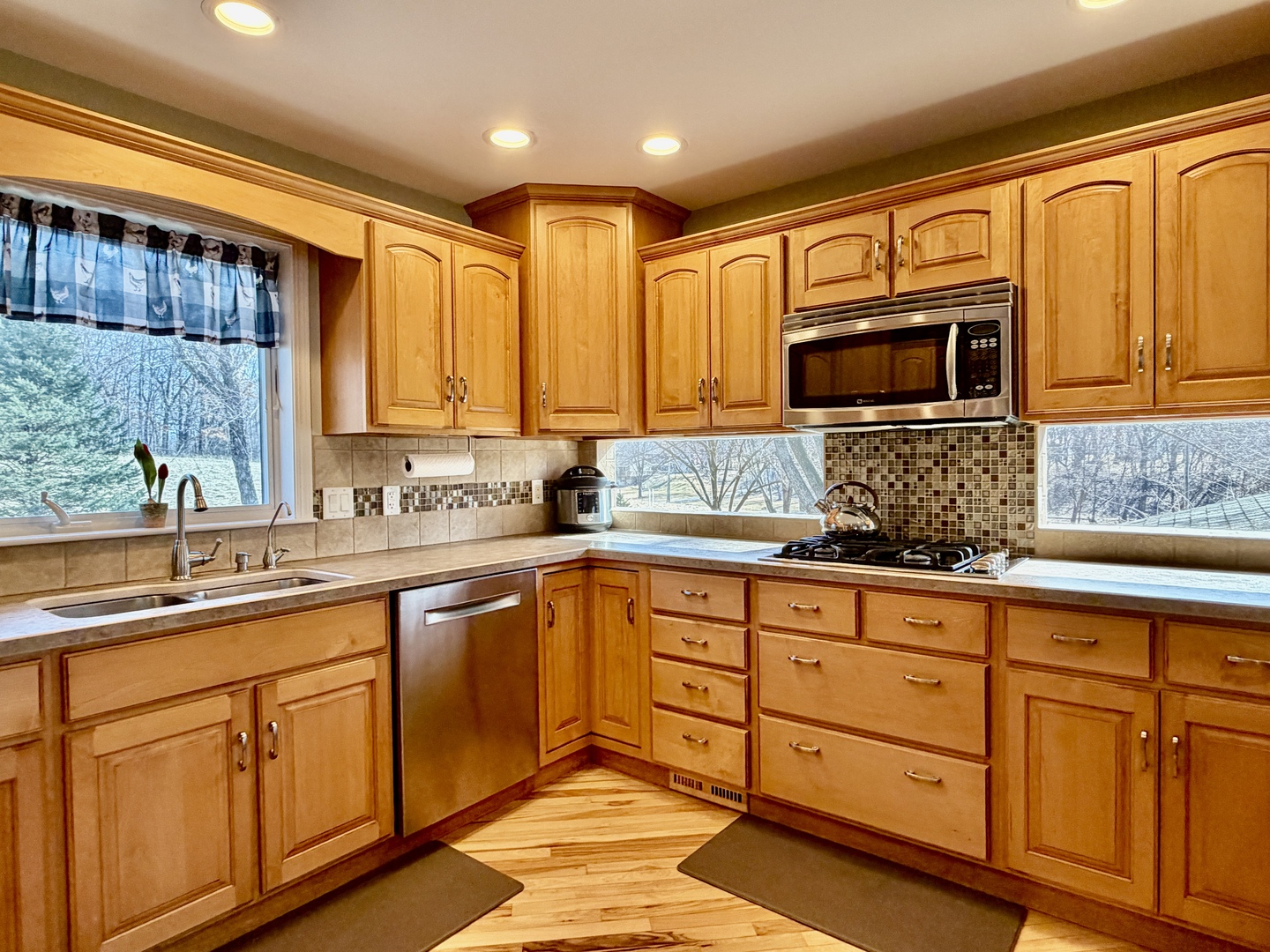 21186 Mathew Road Sterling, IL 61081 - Photo 14 of 66 a kitchen with stainless steel appliances granite countertop a sink stove and microwave