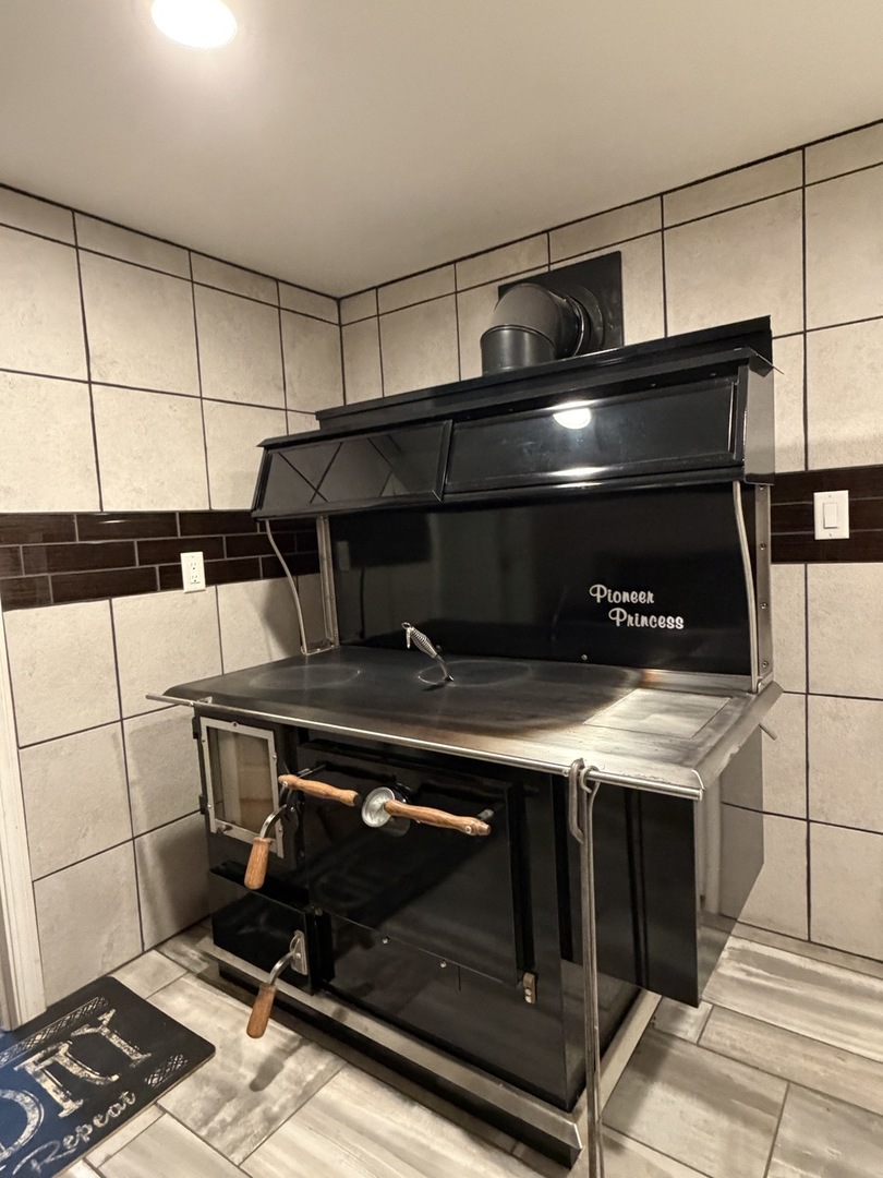 21186 Mathew Road Sterling, IL 61081 - Photo 26 of 66 a stove top oven sitting inside of a kitchen