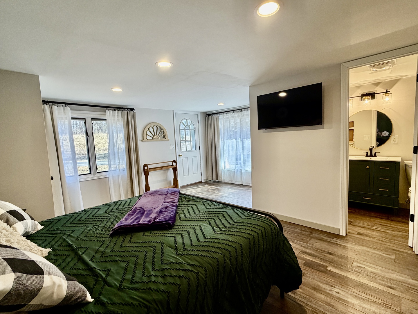 21186 Mathew Road Sterling, IL 61081 - Photo 33 of 66 a bedroom with a bed and a flat tv screen on dresser