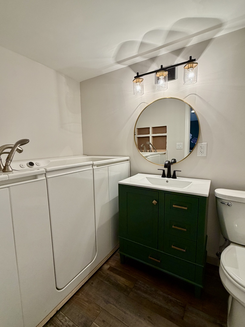 21186 Mathew Road Sterling, IL 61081 - Photo 34 of 66 a bathroom with a toilet sink and mirror