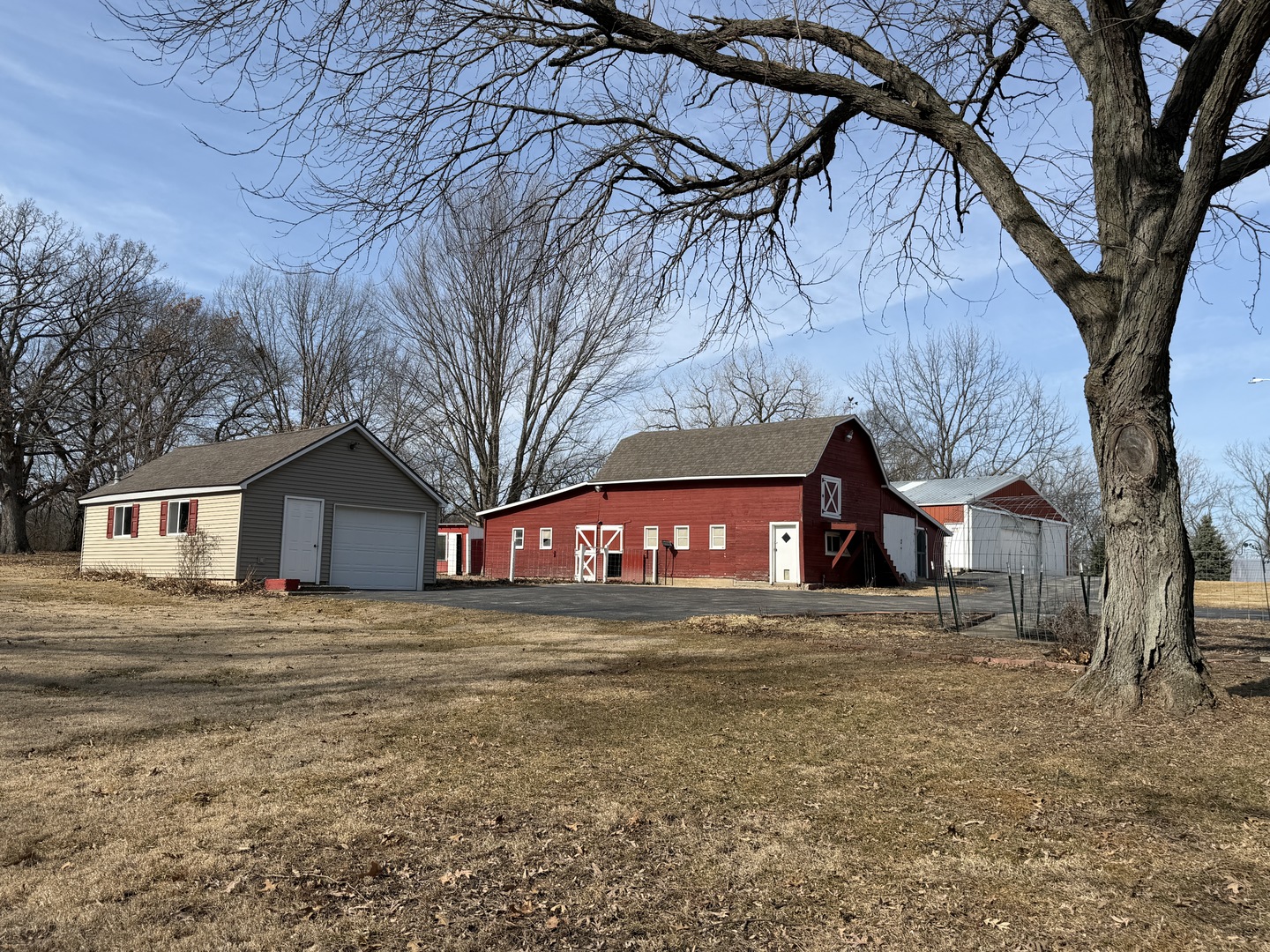 21186 Mathew Road Sterling, IL 61081 - Photo 38 of 66 a house with trees in front of it