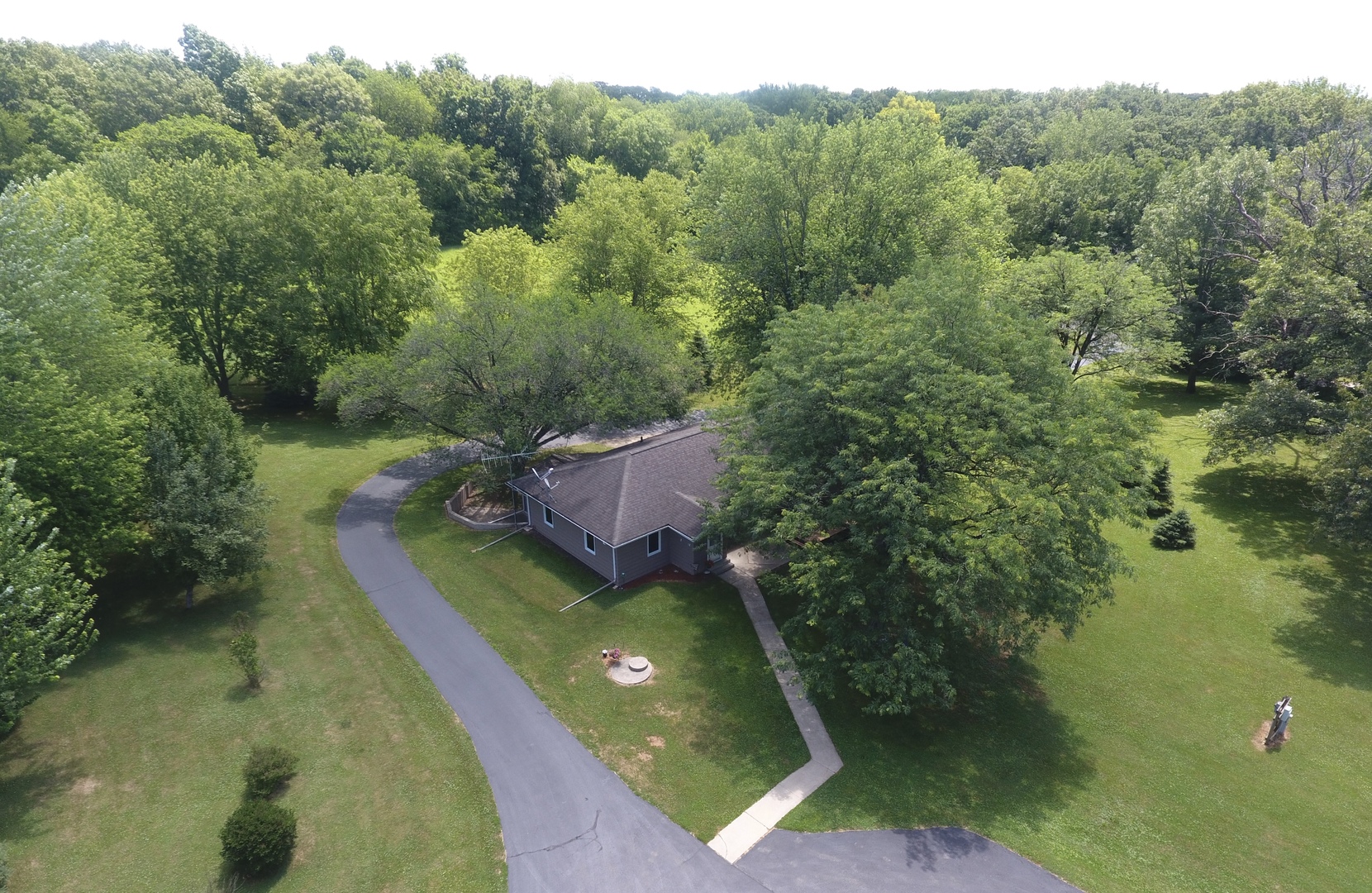 21186 Mathew Road Sterling, IL 61081 - Photo 61 of 66 a view of a lake with a yard