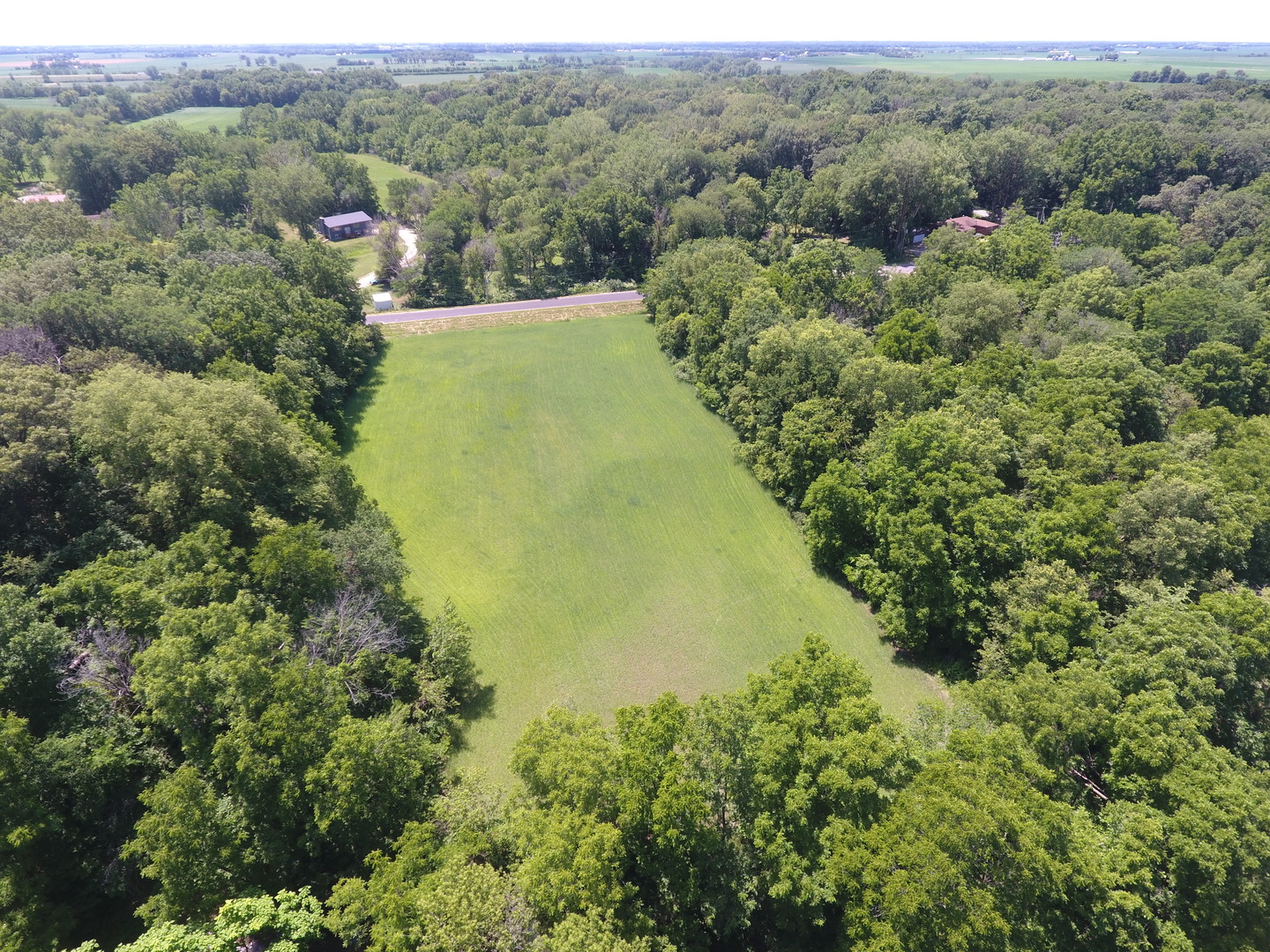 21186 Mathew Road Sterling, IL 61081 - Photo 66 of 66 an aerial view of residential houses with outdoor space and trees