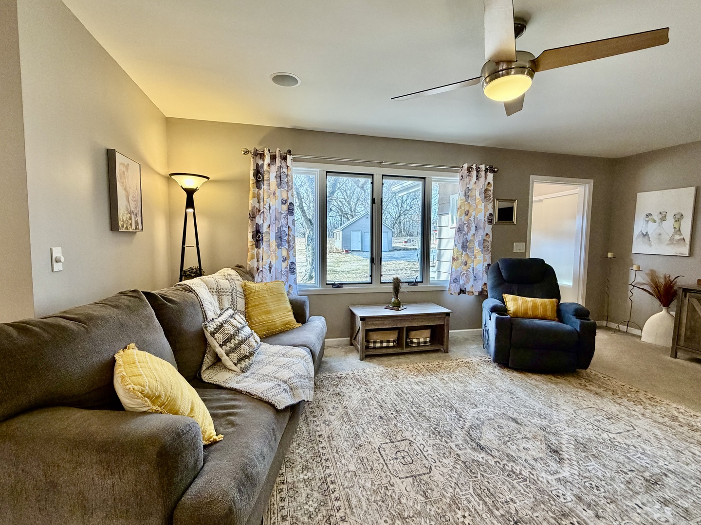 21186 Mathew Road Sterling, IL 61081 - Photo 10 of 66 a living room with furniture ceiling fan and a window
