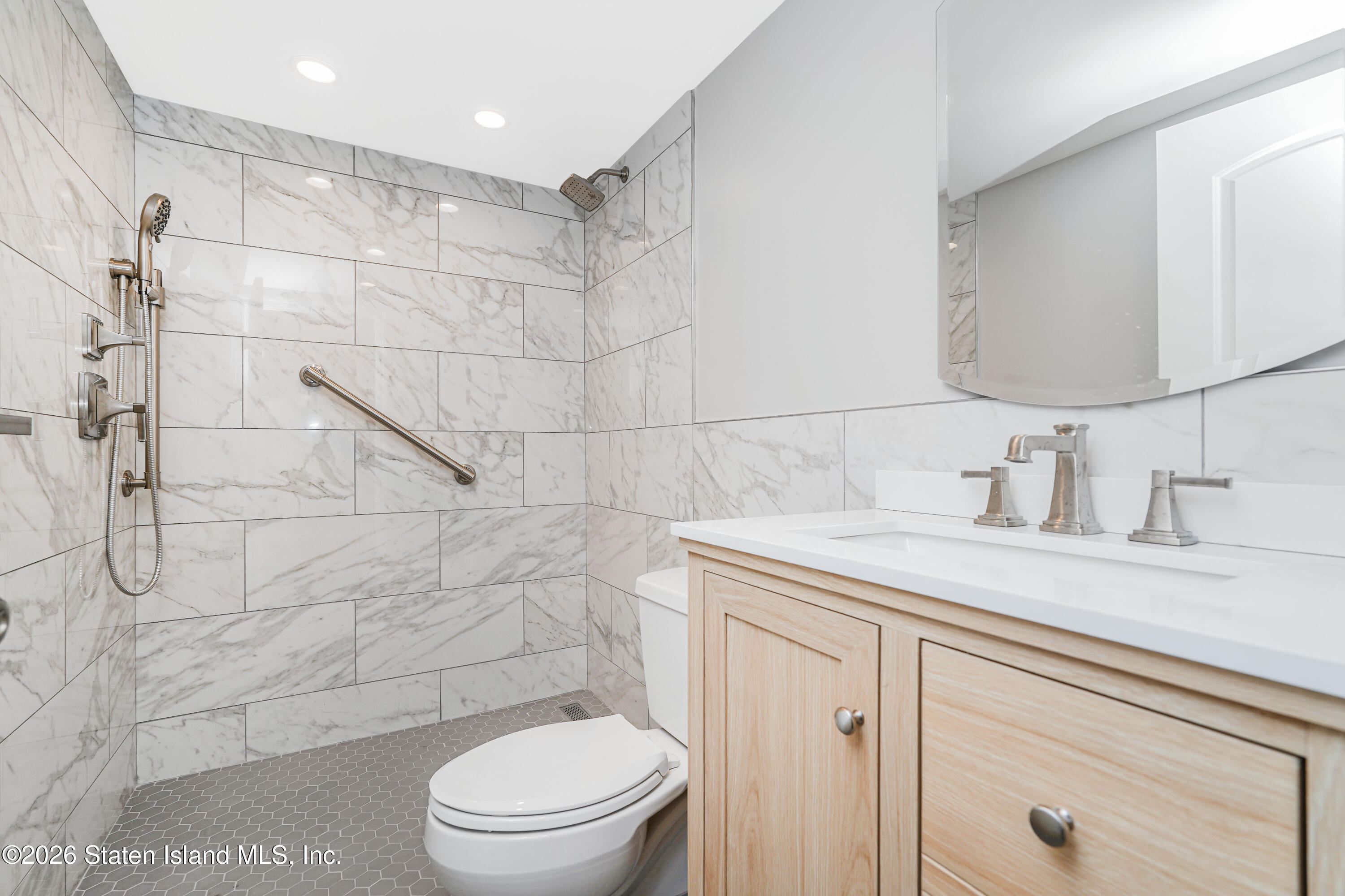 5 Windham Loop, Unit 6E Staten Island, NY 10314 - Photo 18 of 25 a bathroom with a sink toilet and shower