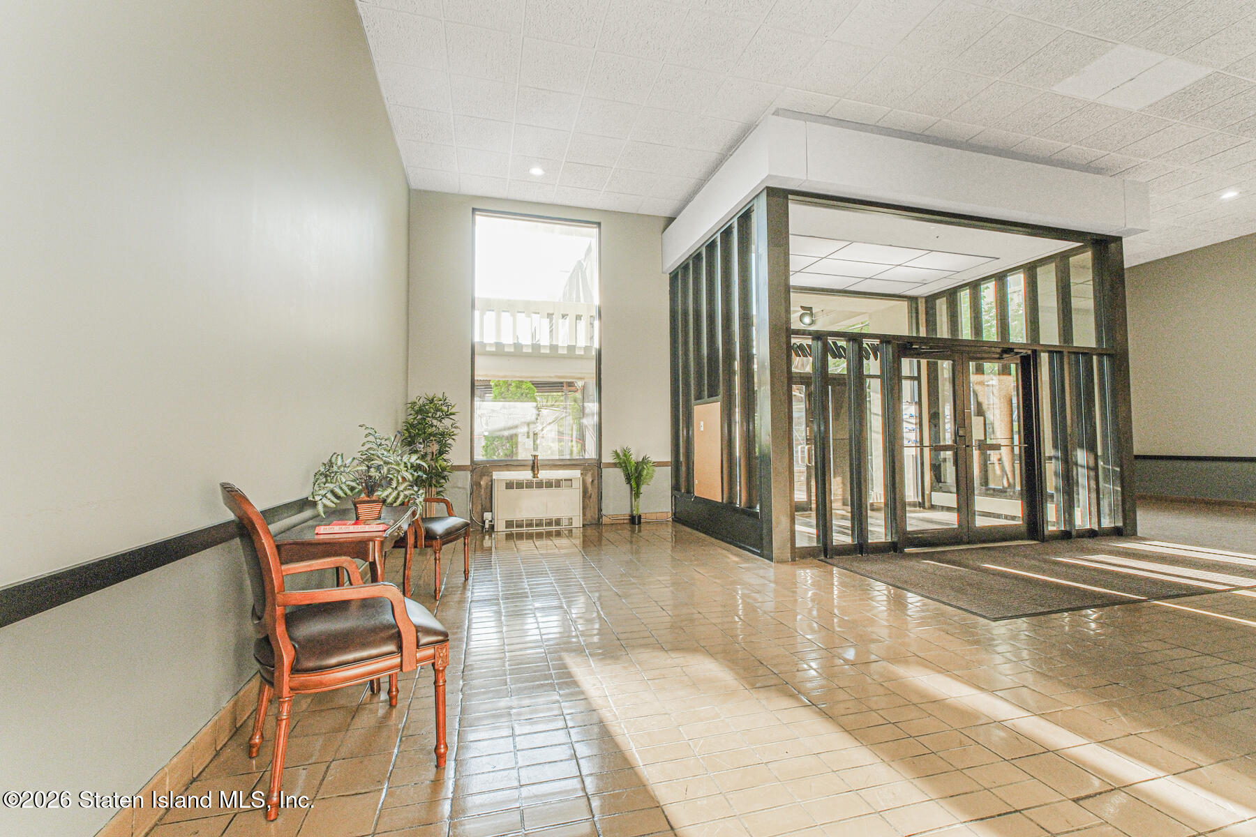 5 Windham Loop, Unit 6E Staten Island, NY 10314 - Photo 2 of 25 a view of a livingroom with furniture and window