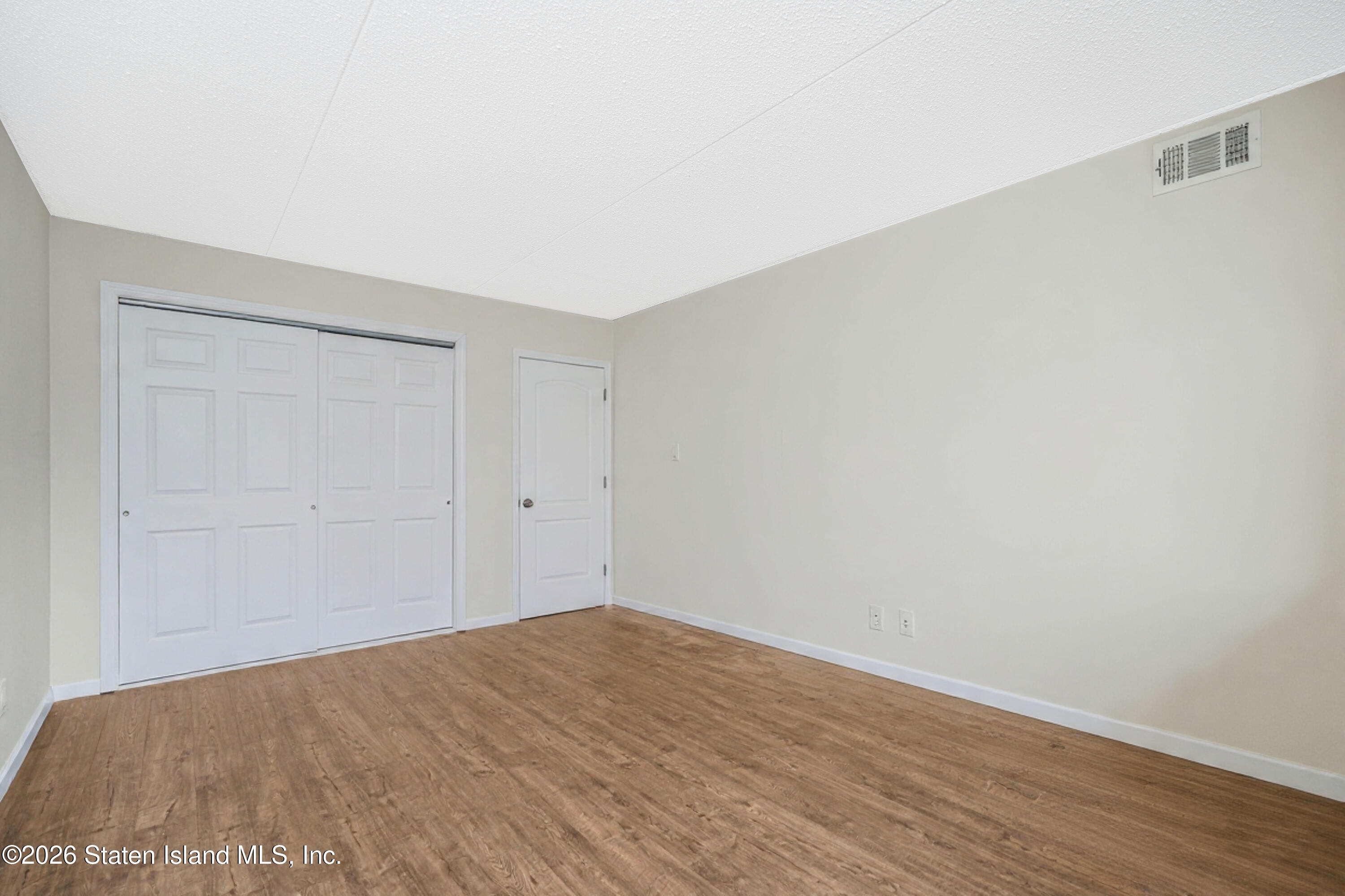 5 Windham Loop, Unit 6E Staten Island, NY 10314 - Photo 21 of 25 a view of empty room
