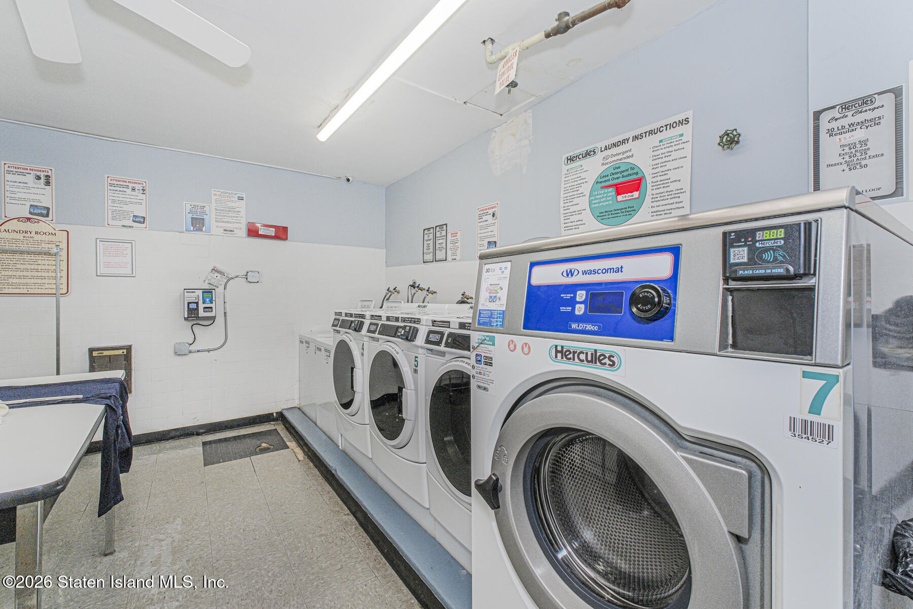 5 Windham Loop, Unit 6E Staten Island, NY 10314 - Photo 22 of 25 a utility room with dryer and washer