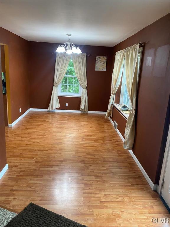 1131 County Line Road Hatboro, PA 19040 - Photo 6 of 18 an empty room with wooden floor and windows