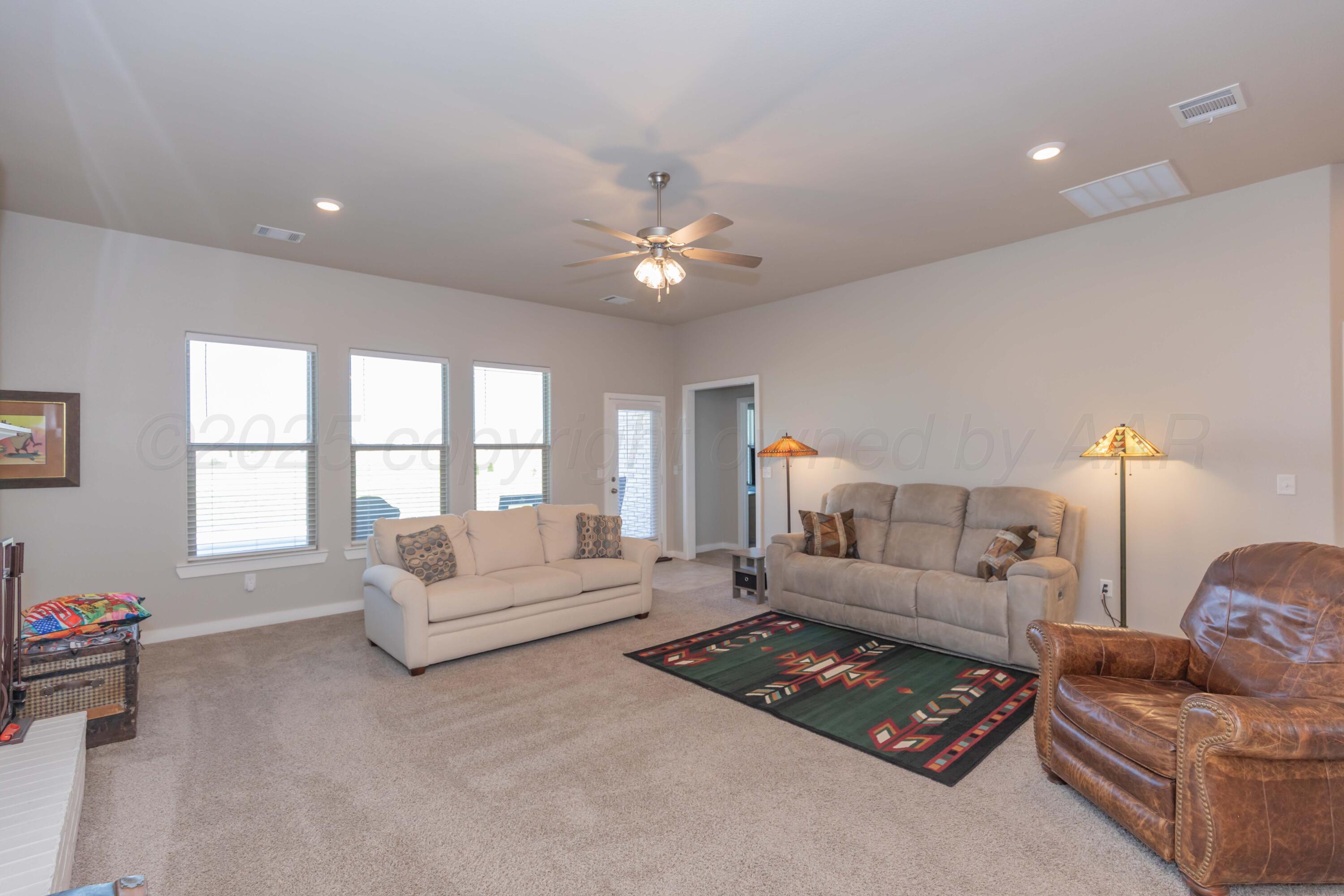 2600 Daybreak Lane Amarillo, TX 79124 - Photo 16 of 52 a living room with furniture and a large window