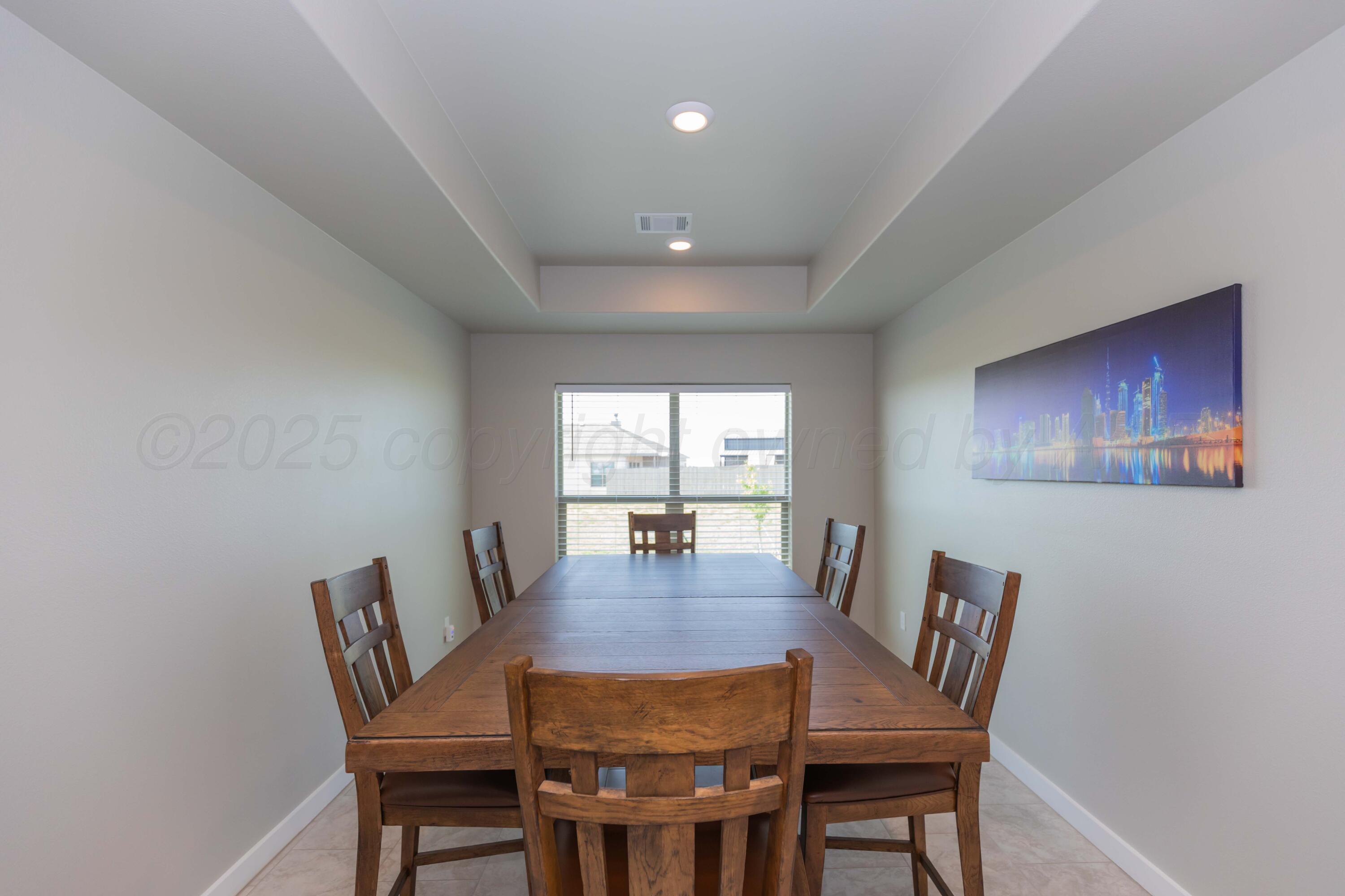 2600 Daybreak Lane Amarillo, TX 79124 - Photo 18 of 52 a view of a dining room with furniture wooden floor and a window