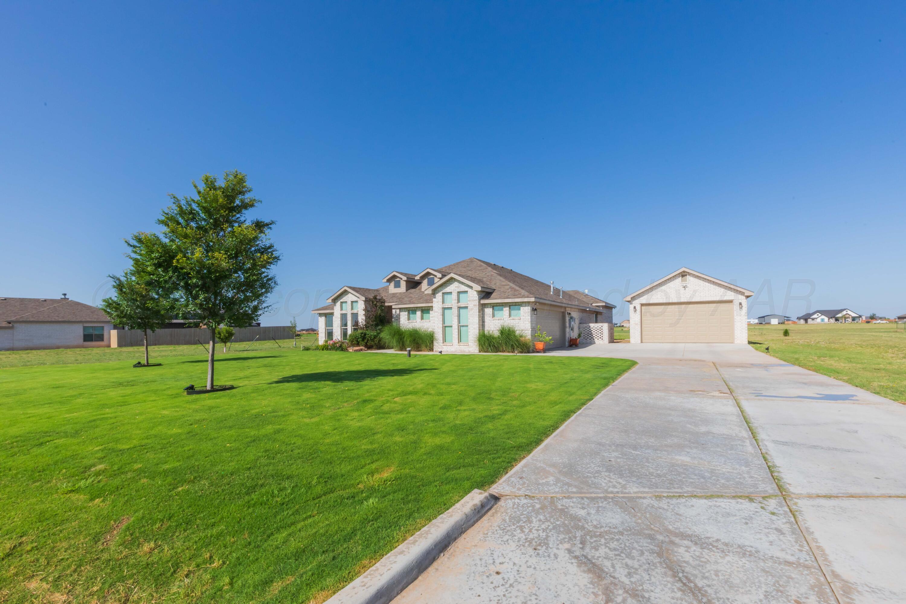 2600 Daybreak Lane Amarillo, TX 79124 - Photo 2 of 52 a view of a large garden with large trees and a big yard