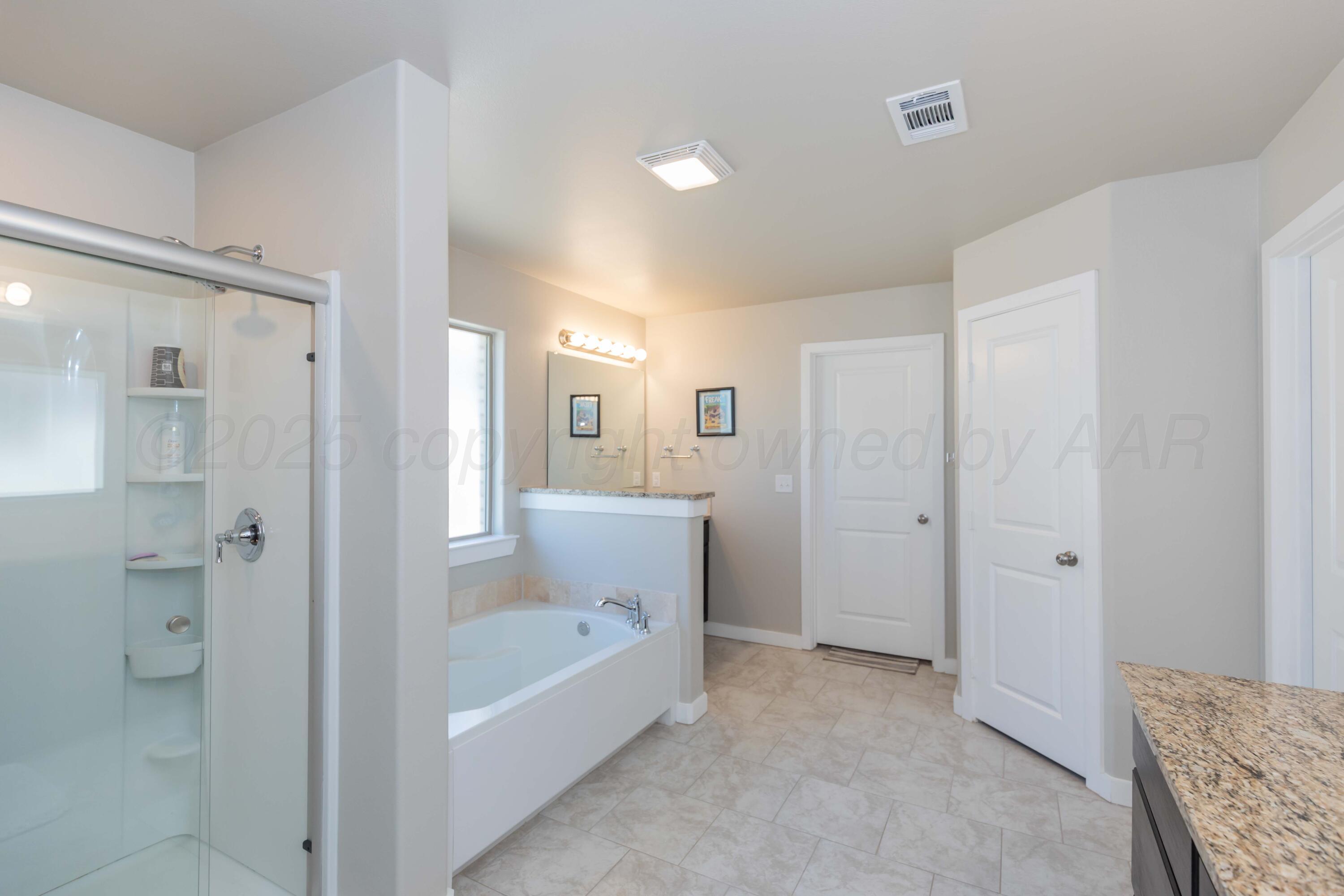 2600 Daybreak Lane Amarillo, TX 79124 - Photo 22 of 52 a bathroom with a bathtub shower and toilet