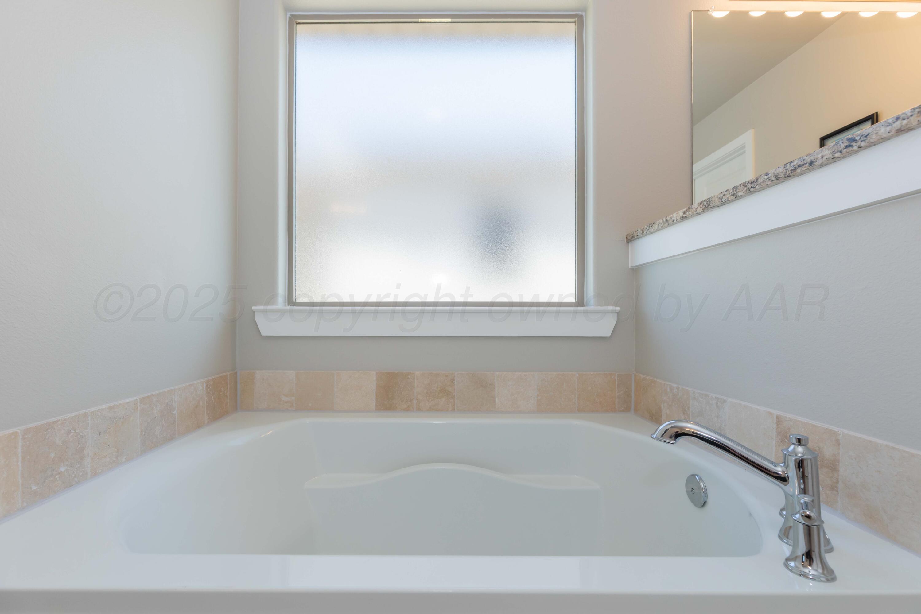 2600 Daybreak Lane Amarillo, TX 79124 - Photo 23 of 52 a white bath tub sitting next to a white sink