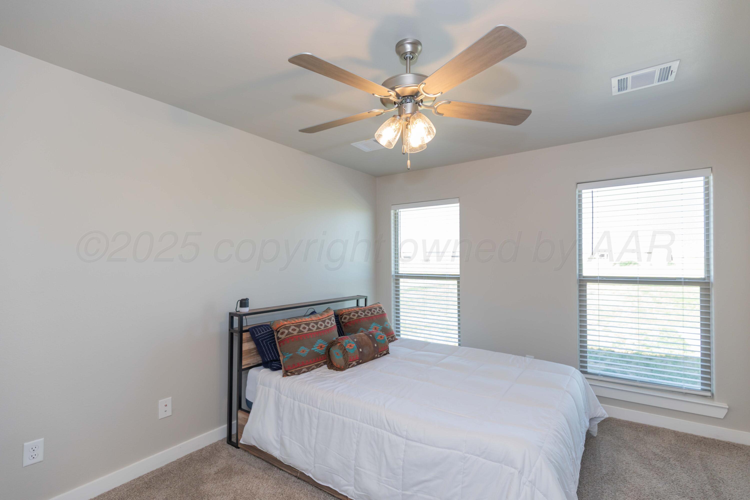 2600 Daybreak Lane Amarillo, TX 79124 - Photo 32 of 52 a bedroom with a large bed and a window