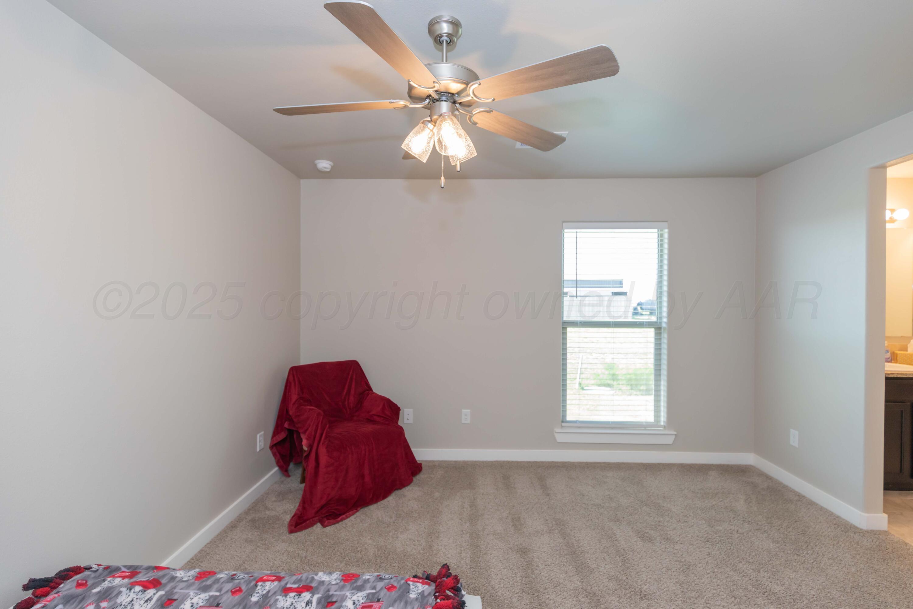 2600 Daybreak Lane Amarillo, TX 79124 - Photo 40 of 52 an empty room with windows and fan