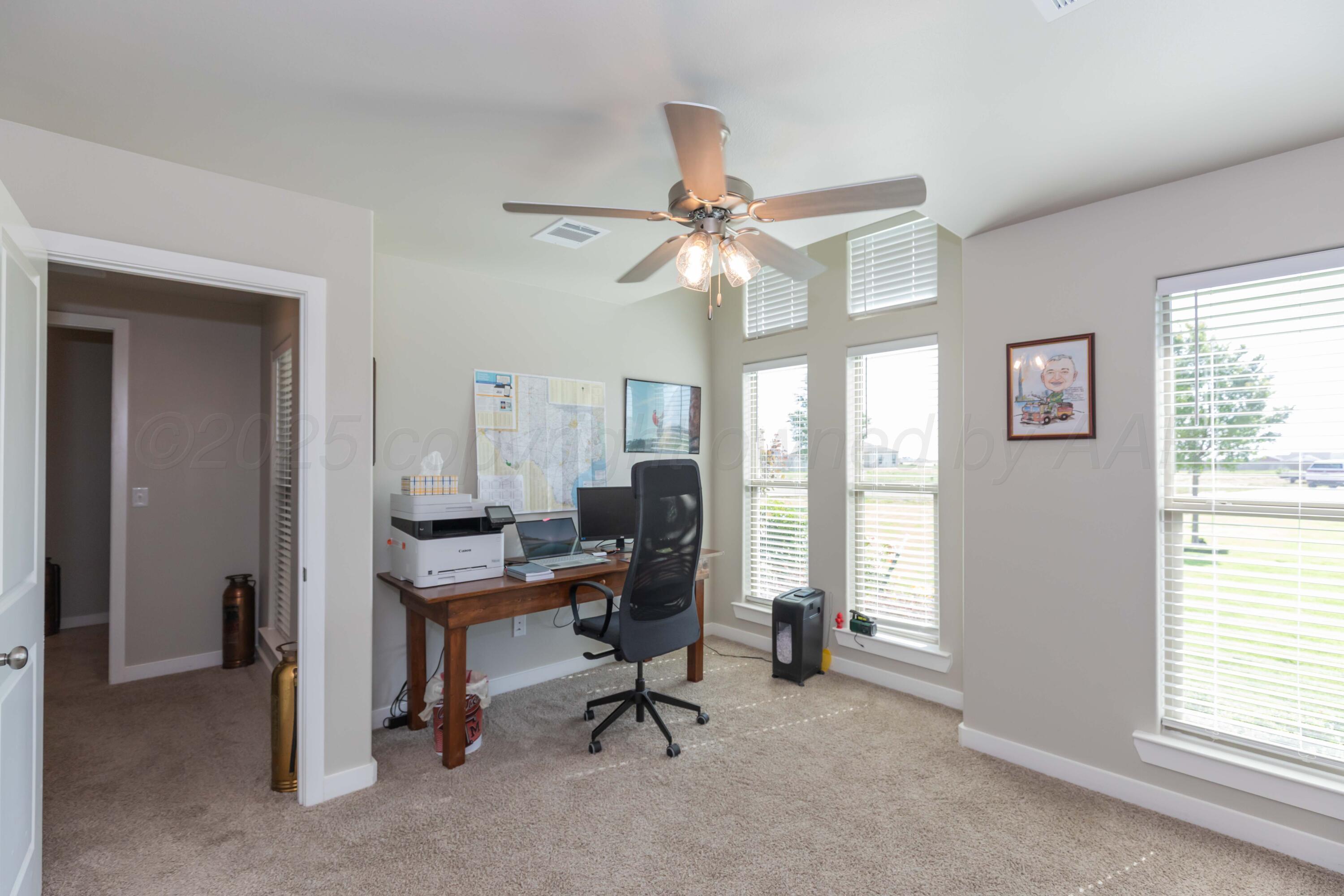 2600 Daybreak Lane Amarillo, TX 79124 - Photo 42 of 52 a view of a workspace with furniture and a window
