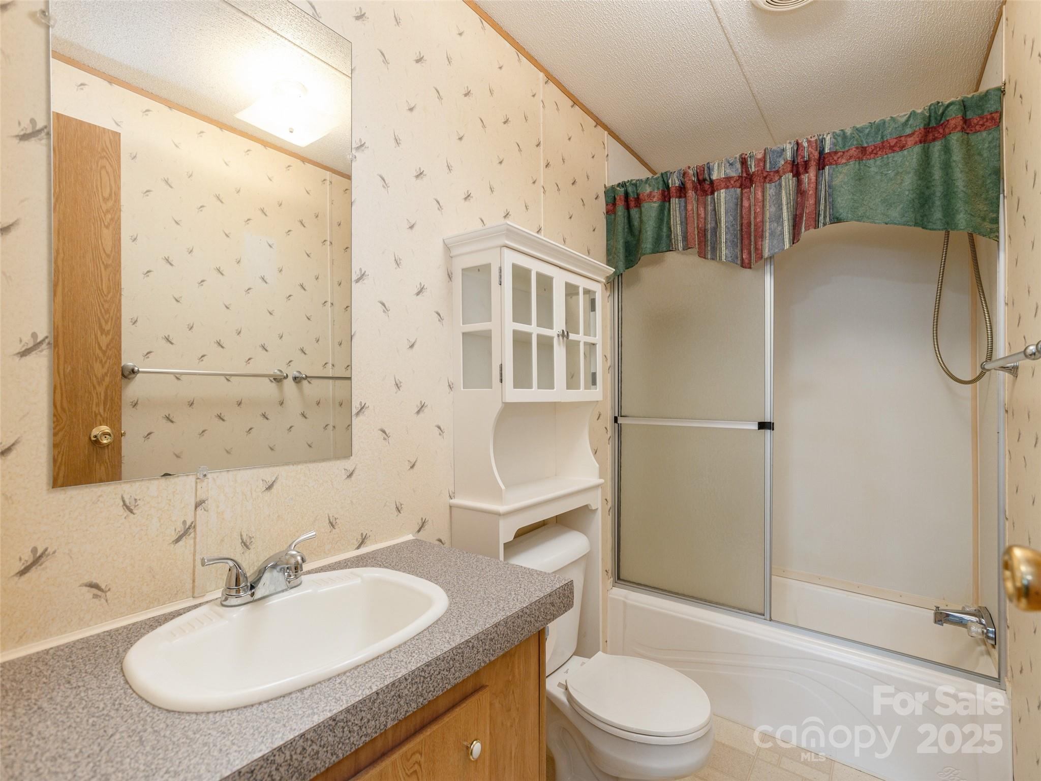 81 Mt Airy Road Marshall, NC 28753 - Photo 11 of 19 a bathroom with a sink toilet and shower