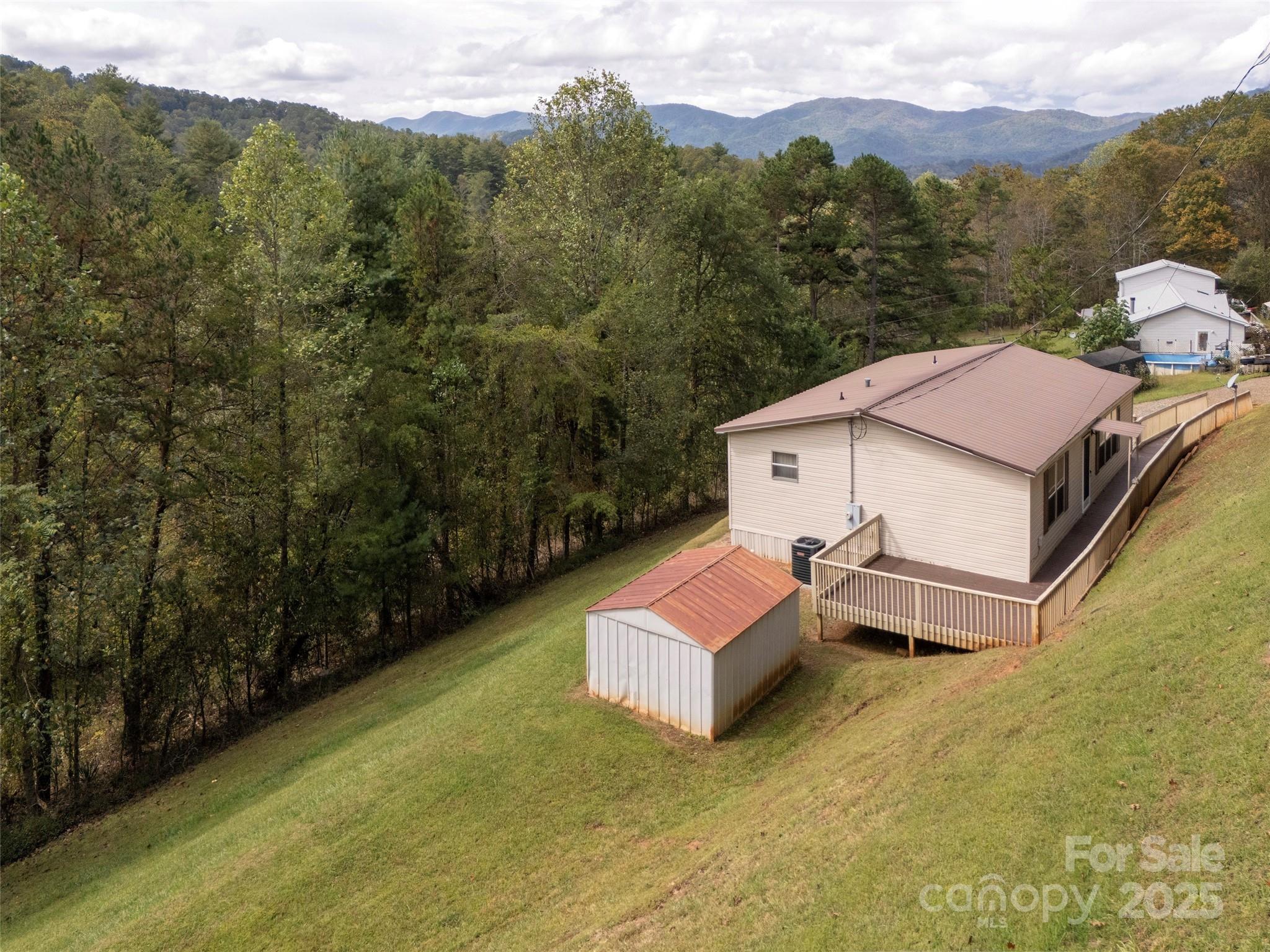 81 Mt Airy Road Marshall, NC 28753 - Photo 2 of 19 a view of a house with a mountain