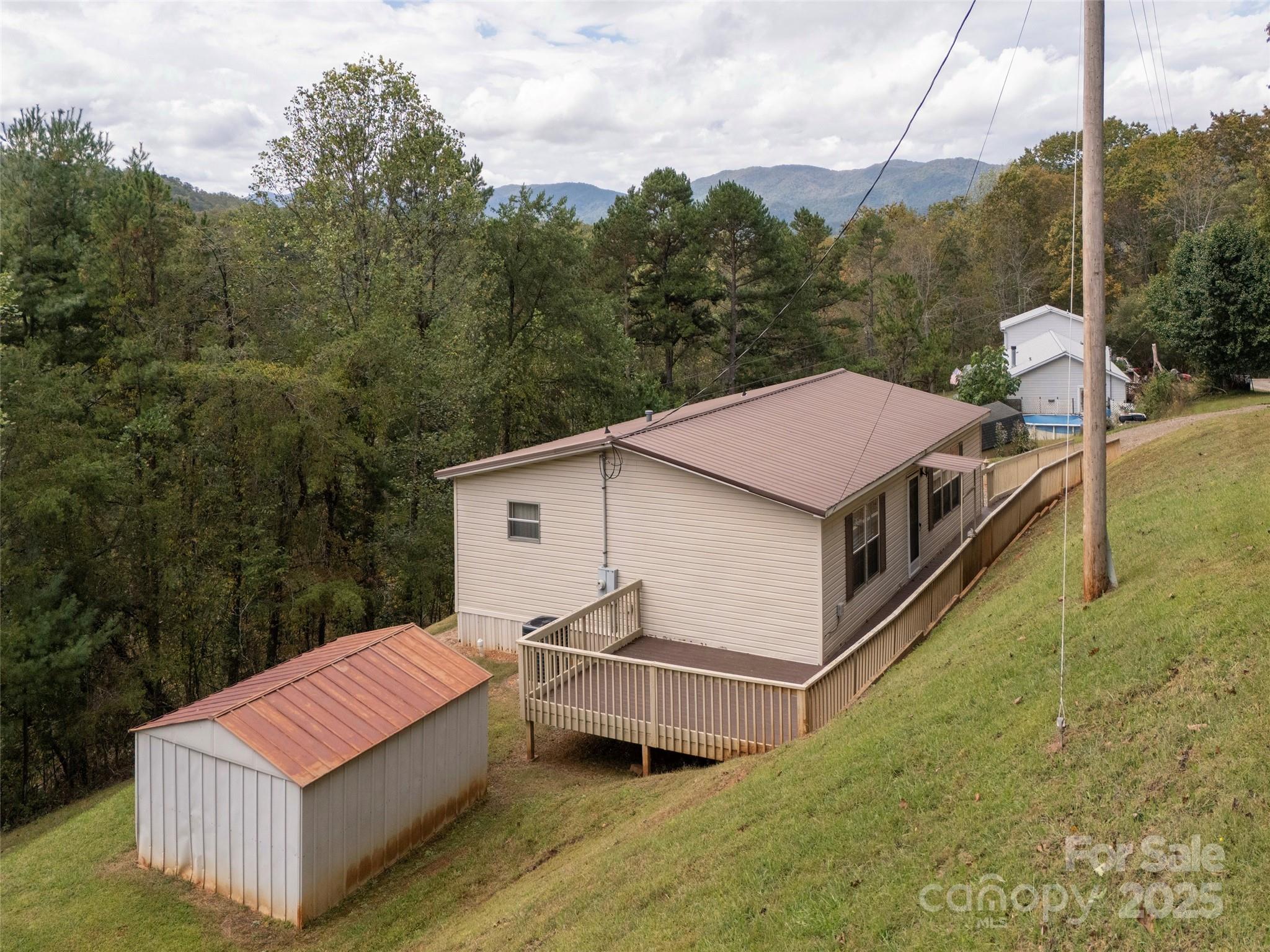 81 Mt Airy Road Marshall, NC 28753 - Photo 3 of 19 a view of a house with a yard and large trees