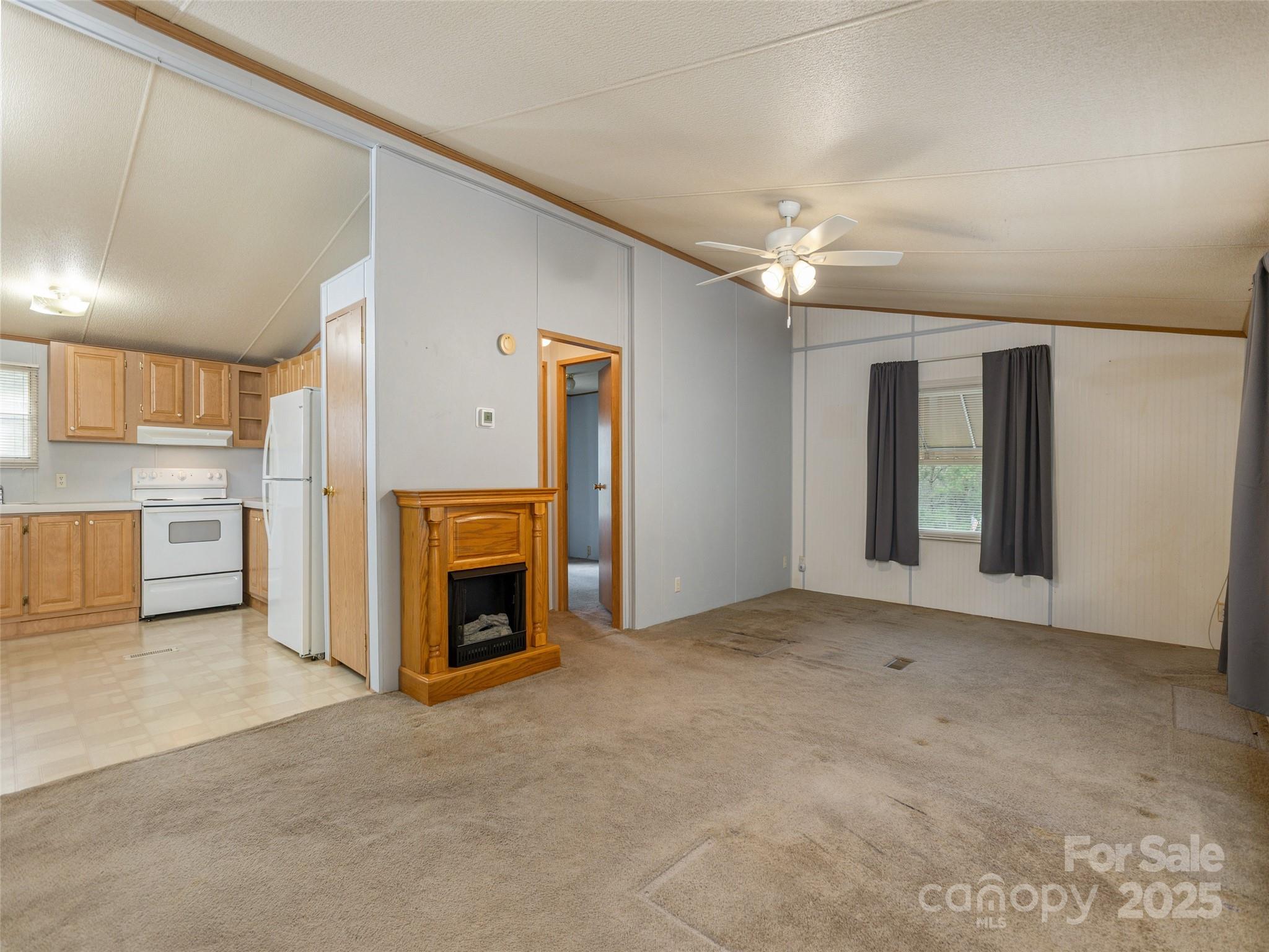81 Mt Airy Road Marshall, NC 28753 - Photo 6 of 19 a view of a kitchen with a sink and a fireplace