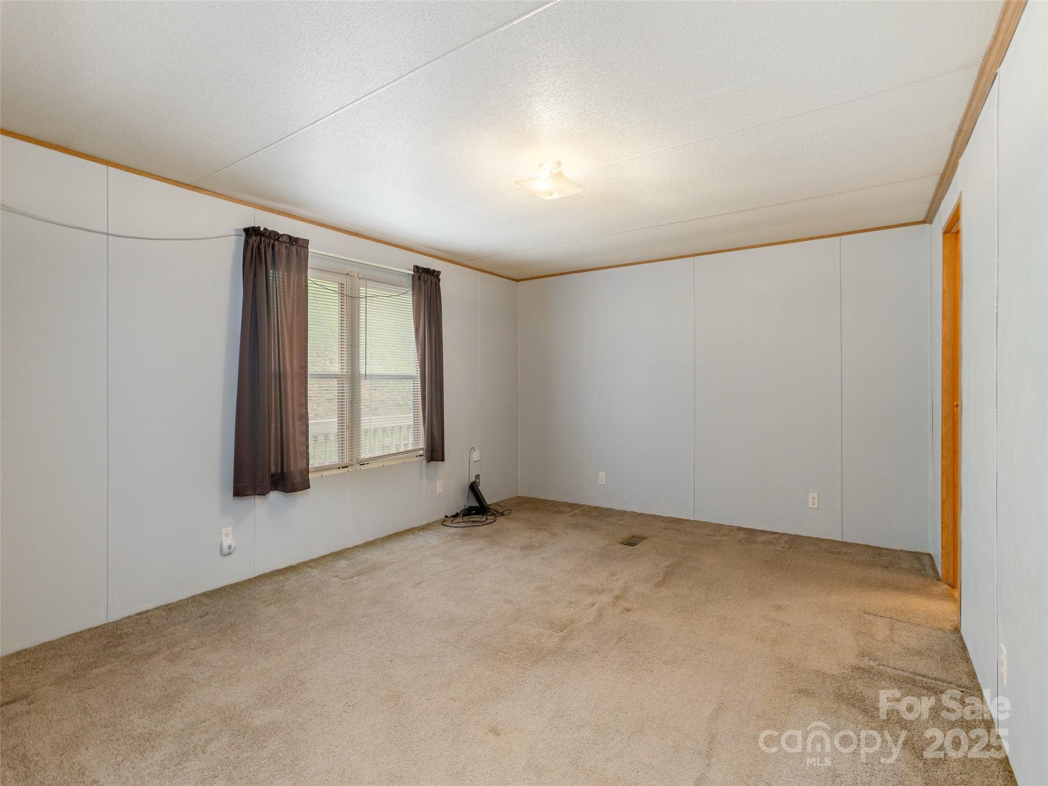 81 Mt Airy Road Marshall, NC 28753 - Photo 8 of 19 an empty room with windows