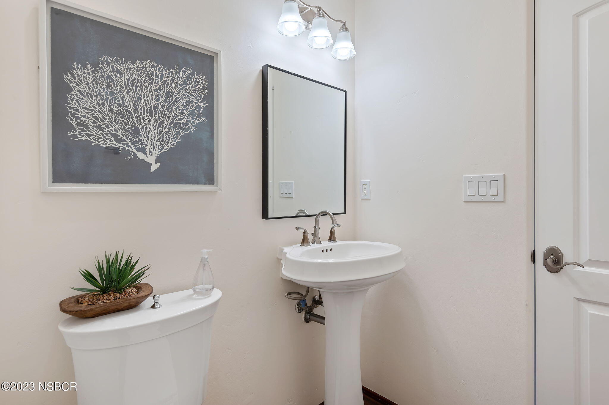 4366 Modoc Road Santa Barbara, CA 93110 - Photo 12 of 23 a bathroom with a sink mirror and vanity