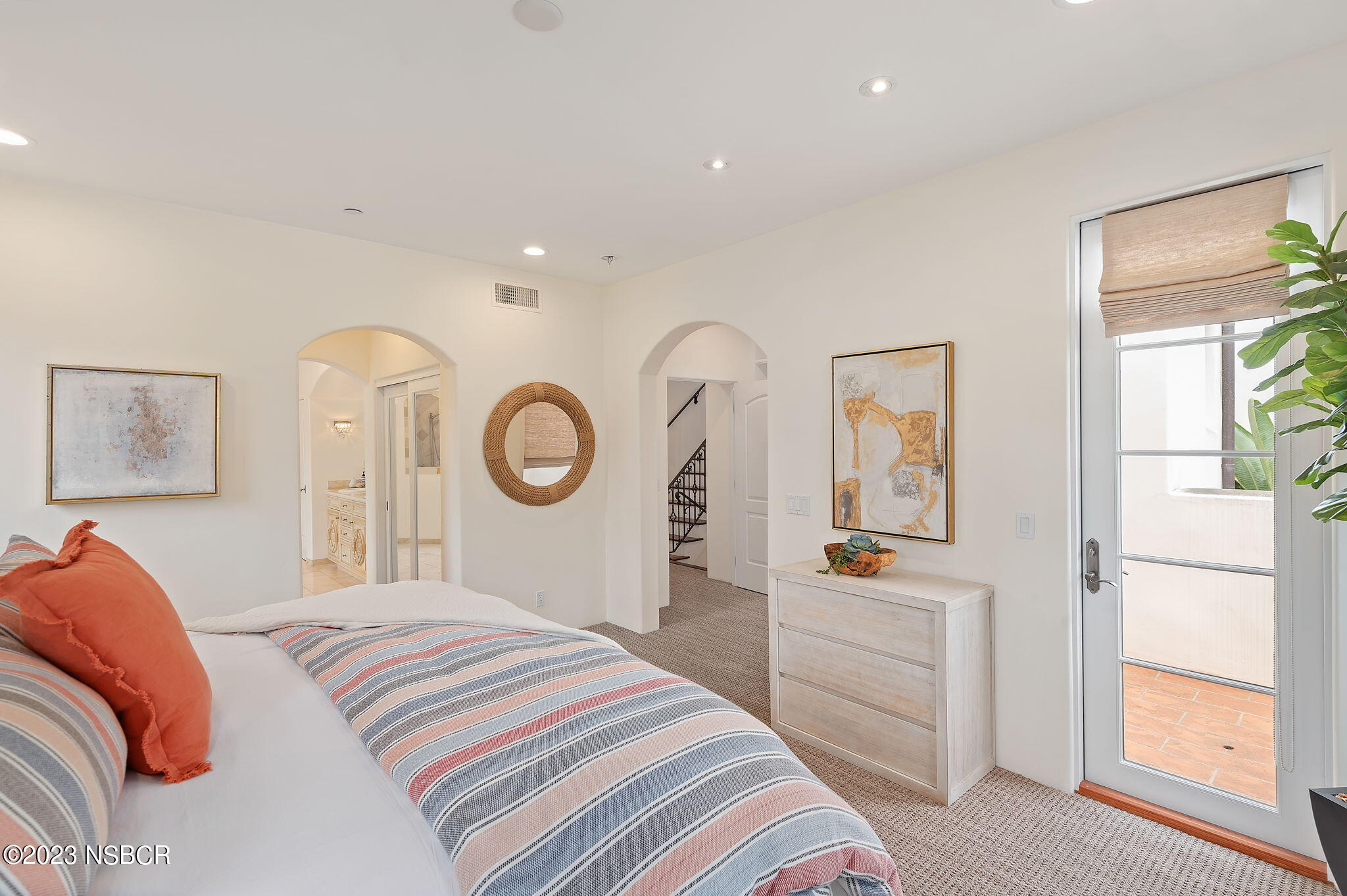 4366 Modoc Road Santa Barbara, CA 93110 - Photo 14 of 23 a bedroom with a bed and a mirror on the dresser