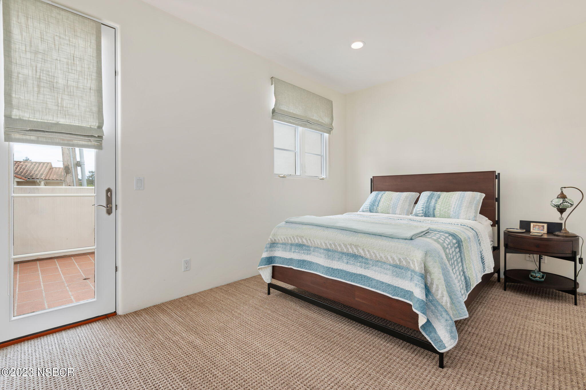 4366 Modoc Road Santa Barbara, CA 93110 - Photo 17 of 23 a bedroom with a bed and a window
