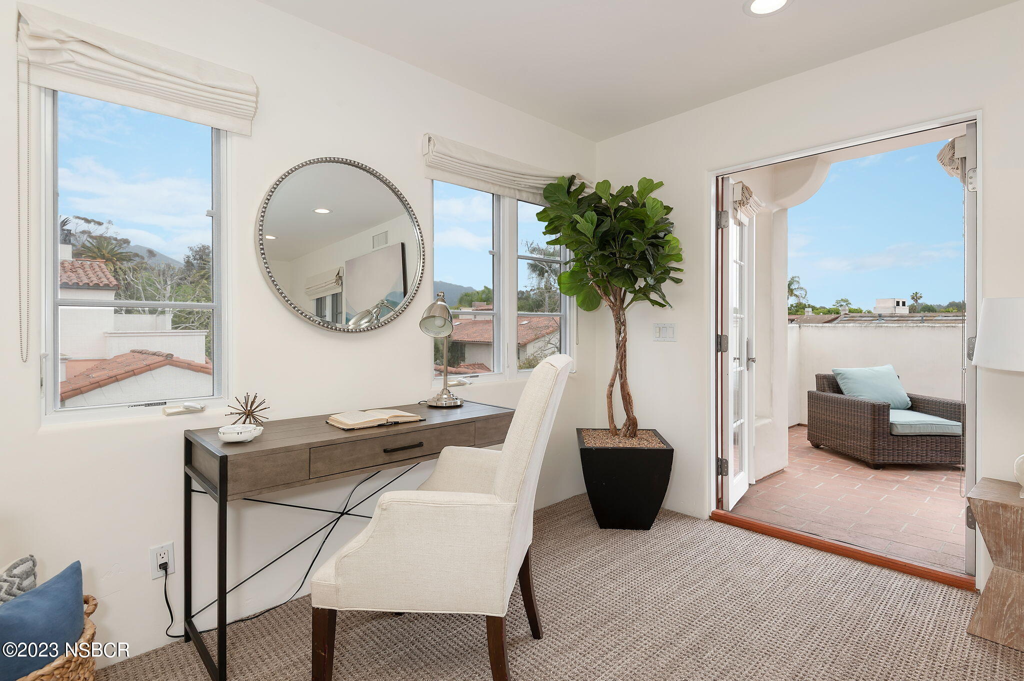 4366 Modoc Road Santa Barbara, CA 93110 - Photo 21 of 23 a living room with furniture and a large window