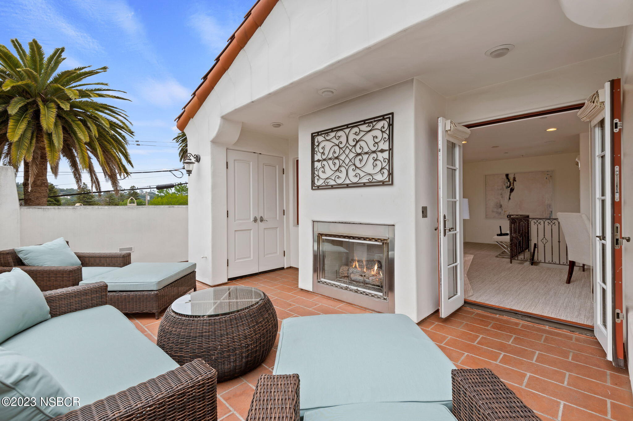 4366 Modoc Road Santa Barbara, CA 93110 - Photo 23 of 23 a living room with furniture and a fireplace