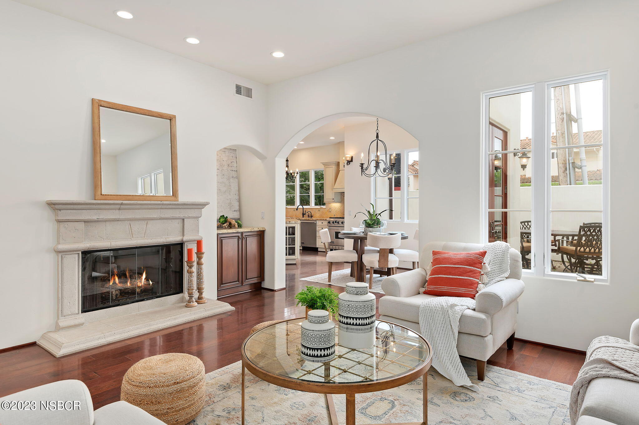 4366 Modoc Road Santa Barbara, CA 93110 - Photo 4 of 23 a living room with furniture a fireplace and a large window