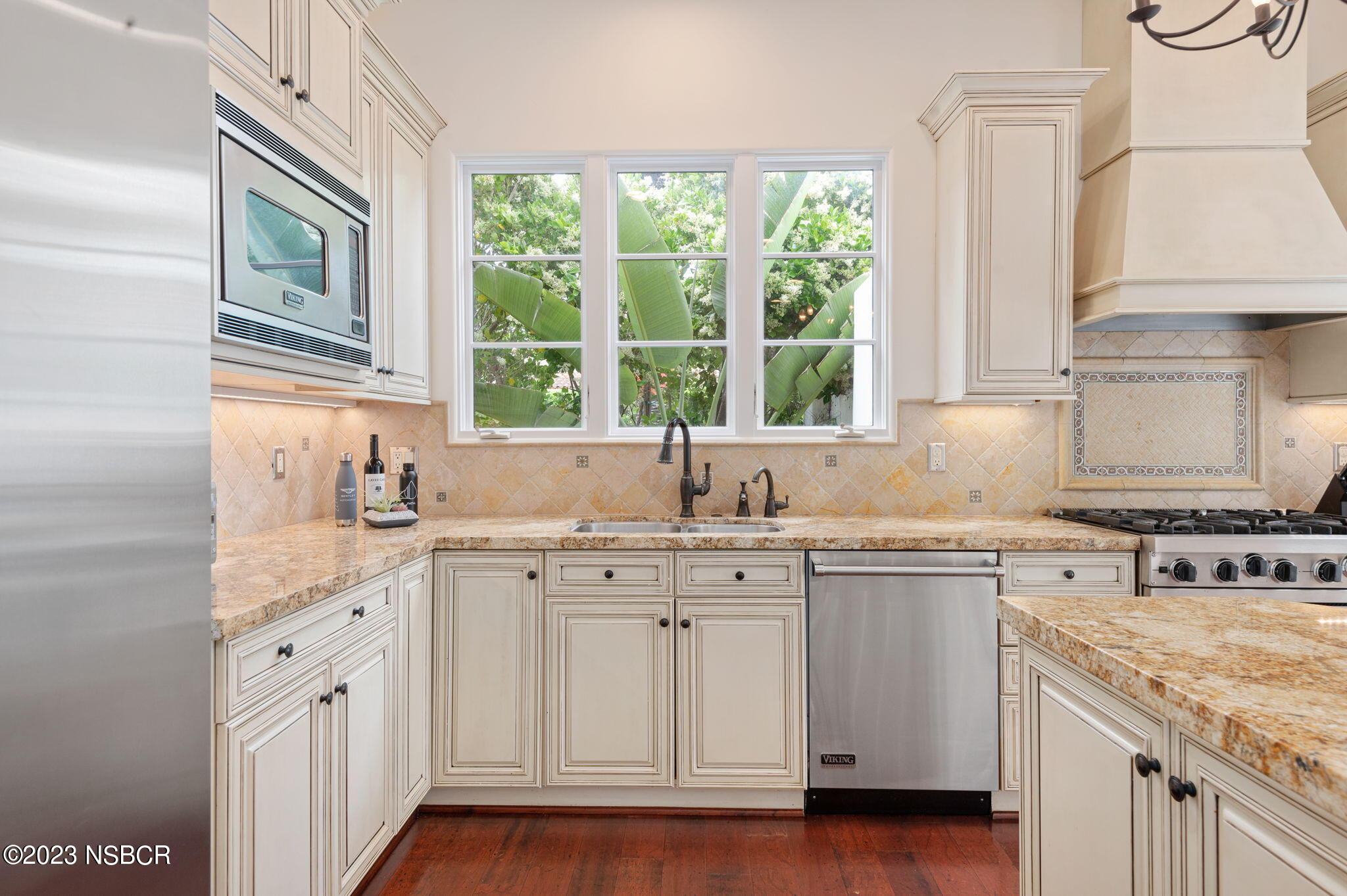 4366 Modoc Road Santa Barbara, CA 93110 - Photo 8 of 23 a kitchen with cabinets appliances a sink and a window