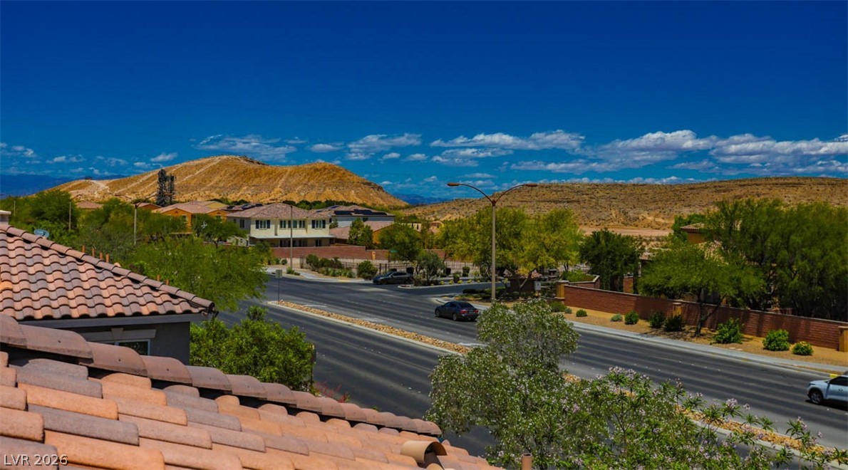 9940 Sable Point Street Las Vegas, NV 89178 - Photo 4 of 40 View of mountain background featuring nearby suburban area