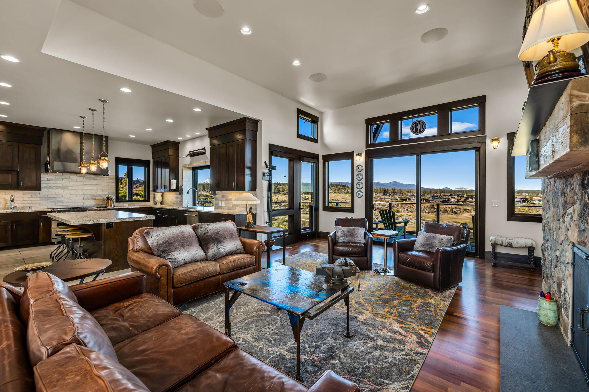Nestled atop the ridge, the rustic elegance of the interiors will warmly welcome you as you walk through the front courtyard into the great room overlooking the spectacular views through the expansive wood framed windows.
