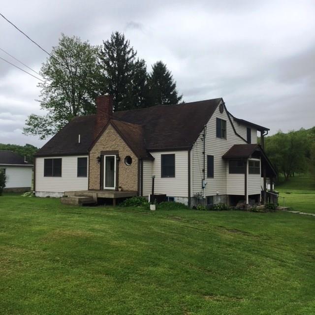 132 Moore Road Butler, PA 16001 - Photo 1 of 24 Over 2900 sq. feet of living space includes 4 bedrooms (3 upstairs and 1 on main level), 2 1/2 baths and many large living areas. Back of house has full view of gorgeous property behind! 2 full-length decks, also. 6-car detached garage to right.