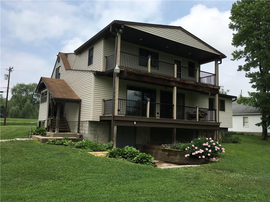 132 Moore Road Butler, PA 16001 - Photo 2 of 24 So much larger than you can tell from driving by! Walkout basement is a fantastic connection between the enormous workbench and the enormous garage! Enjoy the beautiful view a full-length deck on each level!