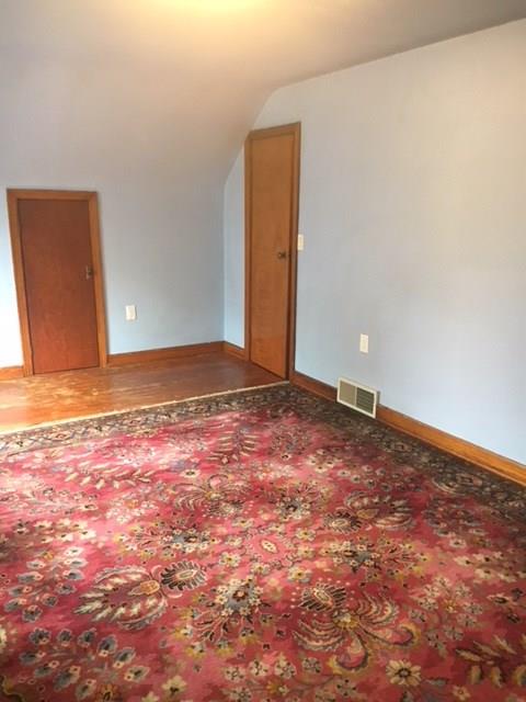 132 Moore Road Butler, PA 16001 - Photo 14 of 24 2nd bedroom upstairs. Full bath across the hall (waterfall tub). Large storage area in attic eaves (smaller door shown).