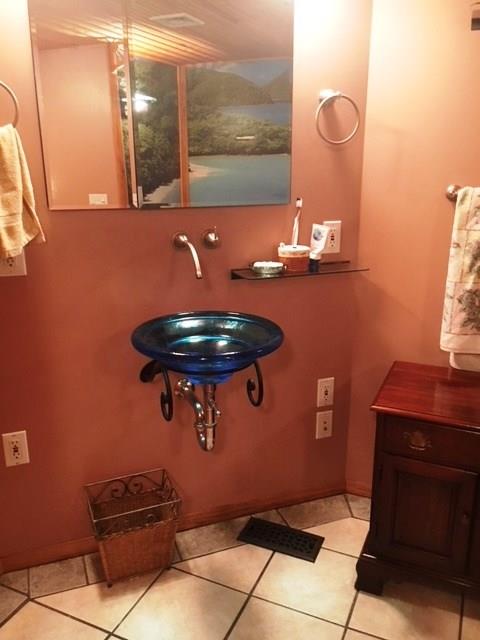 132 Moore Road Butler, PA 16001 - Photo 19 of 24 Fun theme in the 2nd full bath upstairs (note Caribbean wall mural above tub you can see in the mirror reflection). Also a shower in this bathroom.