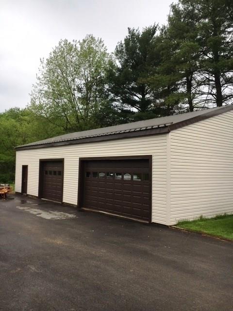 132 Moore Road Butler, PA 16001 - Photo 4 of 24 50' x 30' garage can fit 6 vehicles. Water and electric. Generous sized driveway, also.