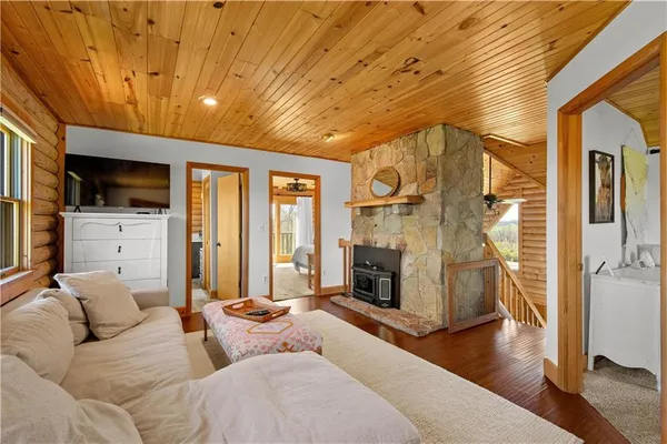 a living room with furniture flat screen tv and a fireplace