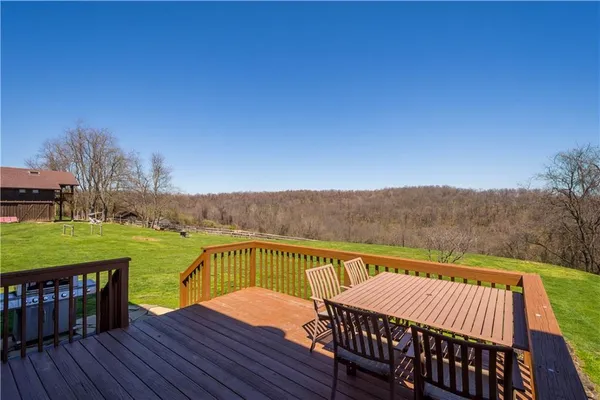a view of a balcony with lake view and wooden floor