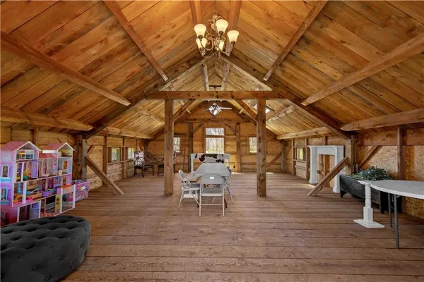 a view of a hall with wooden floor